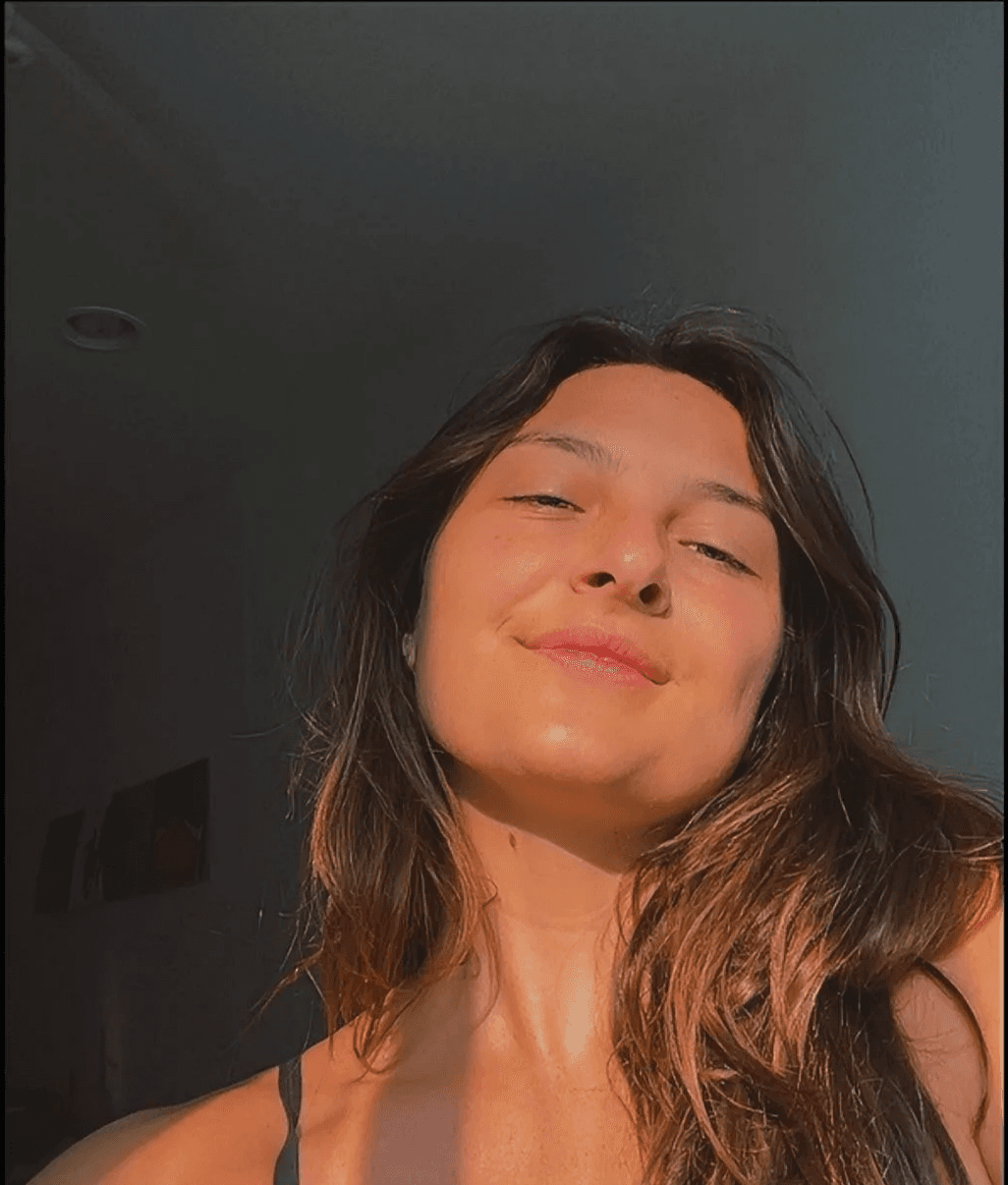 Ali smiling in warm sunlight